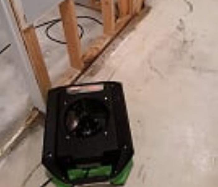 clean floor with air mover n the bottom left corner